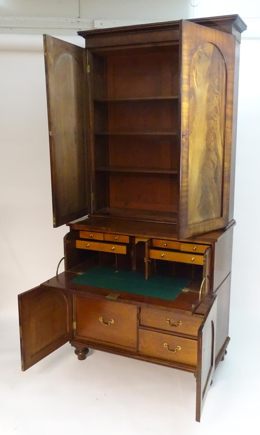 A mid 19thC mahogany secretaire bookcase, having a moulded cornice above two flame mahogany panelled - Bild 6 aus 8