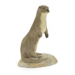 An Acorn pottery model of a standing otter. Signed P. Tunstall under. Approx. 3 3/4" high Please
