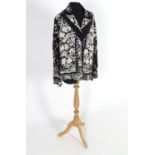 An oriental silk black vintage jacket, embroidered with cream flowers, birds and butterflies. Bust