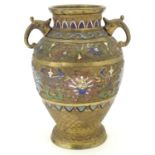 A Japanese gilded brass vase of ovoid form with twin handles and cloisonne decoration. Approx. 9 1/