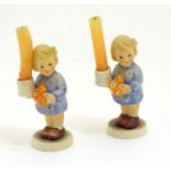 A pair of Vintage Hummel candle holders, girl with candle, model no. #115 impressed to base beside