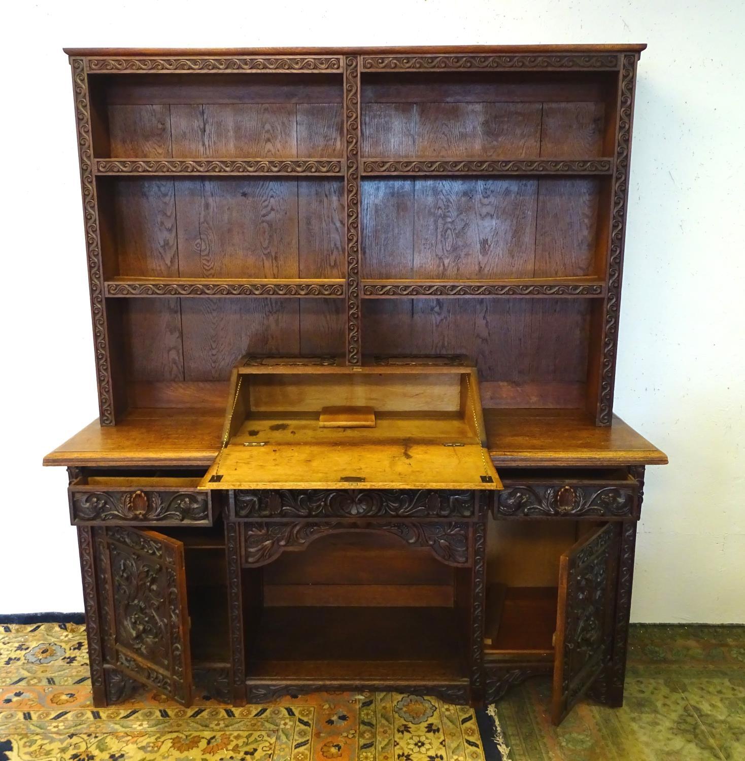 An early 20thC dresser with a blind fretwork carved plate rack above a carved slope and three - Bild 5 aus 5