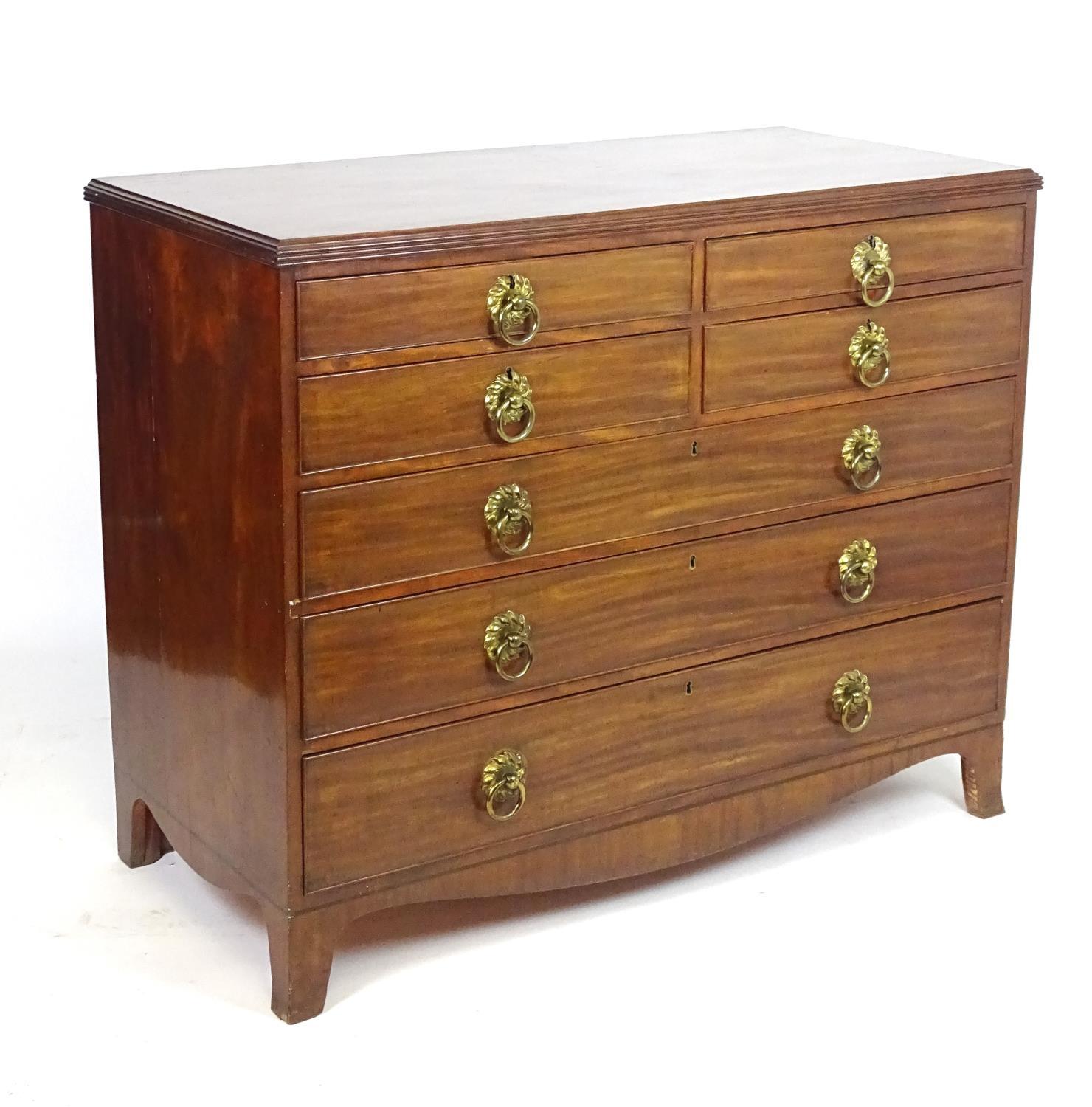 A mid 19thC mahogany chest of drawers with a rectangular reeded top above an unusual set of four
