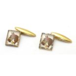 Gilt plated cufflinks with essex crystal style cabochon decoration depicting horse heads. Please