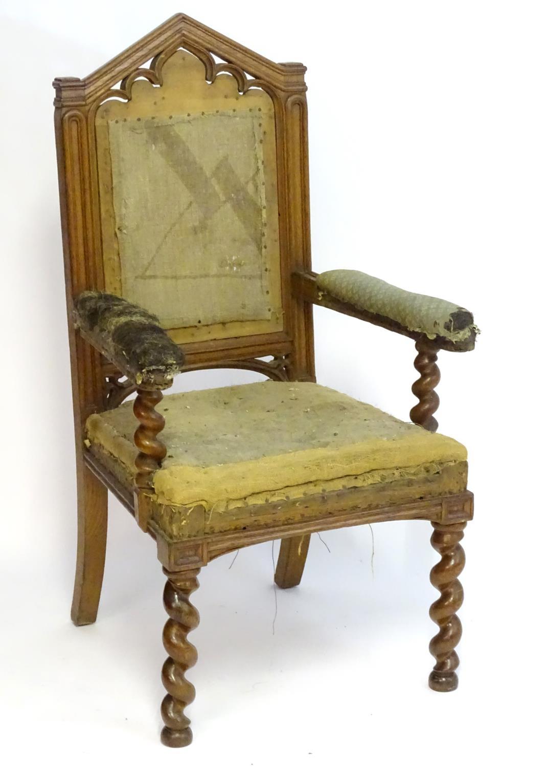 A mid / late 19thC oak armchair with a pointed pierced cresting rail, moulded frame and raised on - Bild 3 aus 6
