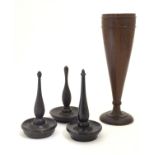 Four items of early 20thC treen, comprising three ring trees / jewellery holders and a spill vase.