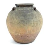 An antique clay pot / vase with loop handles and incised banded detail. Approx. 14 1/2" high