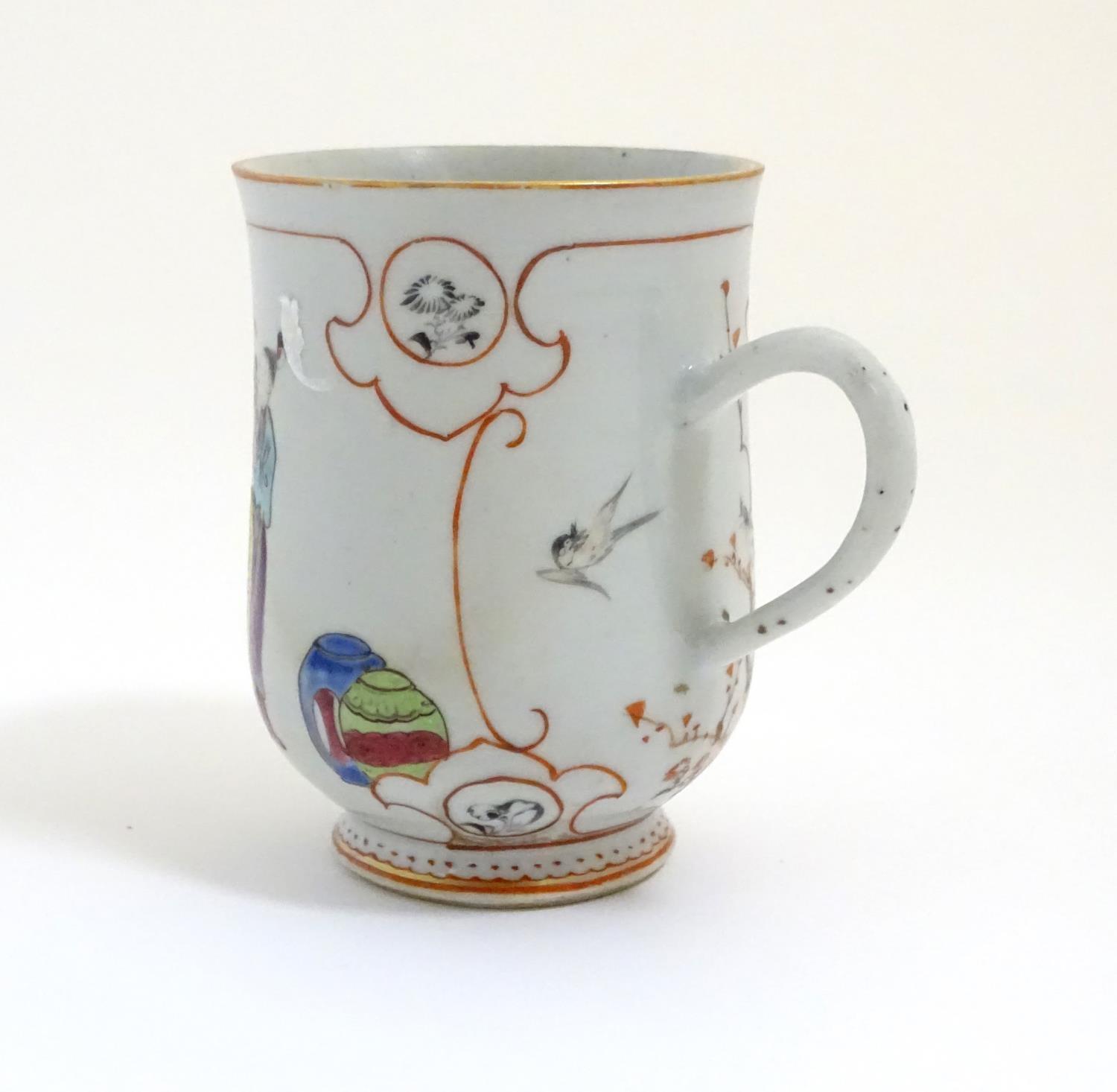 A Chinese export famille rose mug / tankard decorated with figures in a domestic interior scene, and - Image 4 of 5