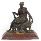 A 19thC bronze sculpture modelled as Omphale, Queen of Lydia seated on the skin of a lion and