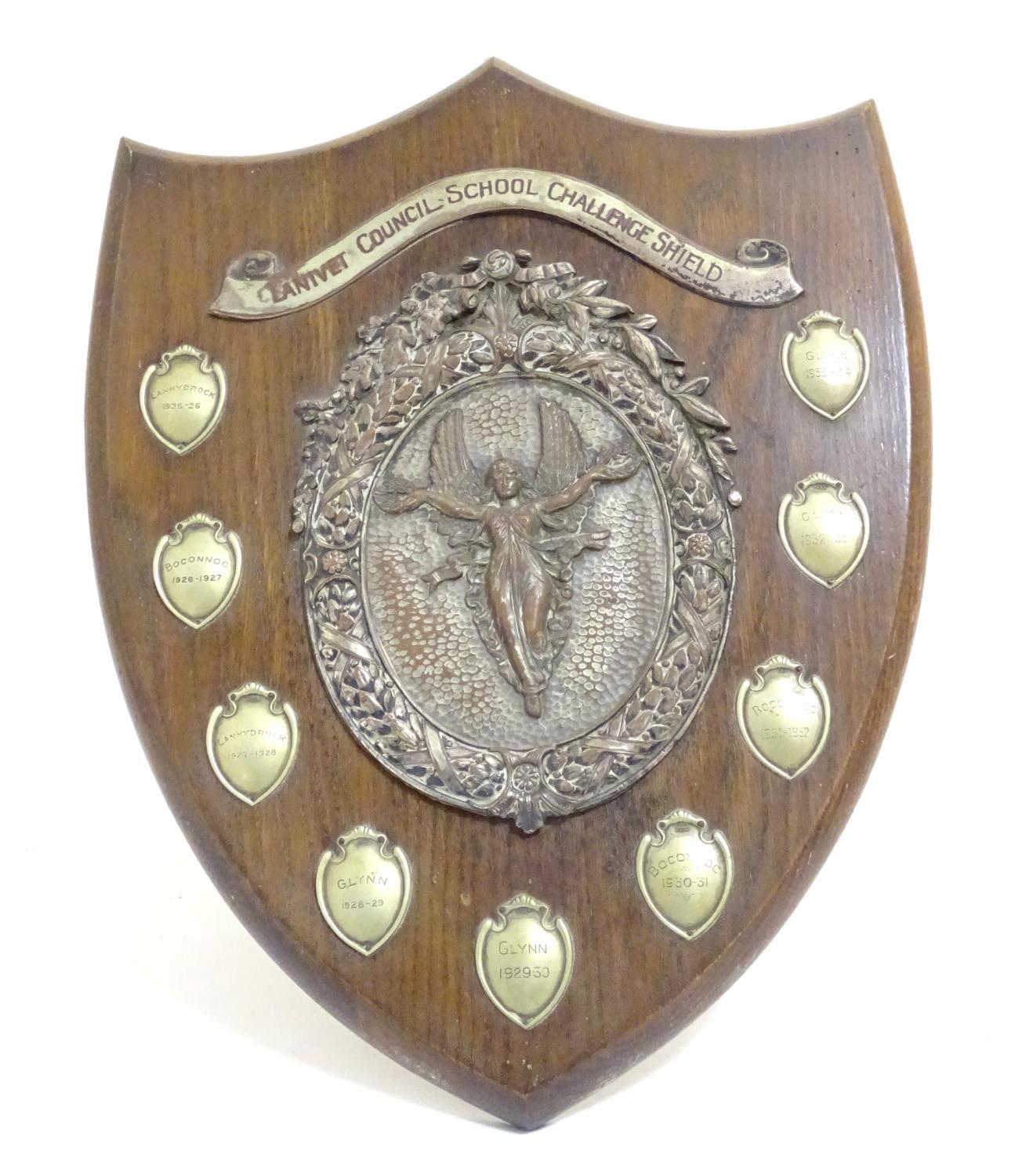 An early - mid 20thC trophy shield, of carved oak with silver plated mounts, inscribed Lanivet