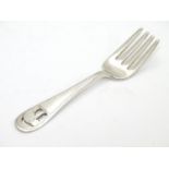 An American Arts and Crafts sterling silver small fork. Having pierced and engraved design of an