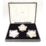 Three WMF silver plated leaf-form pickle dishes with berry detail, each raised on three bun feet.