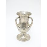 An Art Nouveau silver pedestal trophy cup with three handles. hallamrked Bimirngham 1902 maker