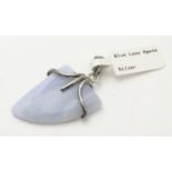 A silver mounted hardstone set pendant, the polished Blue Lace Agate formed as a stylised shark?s