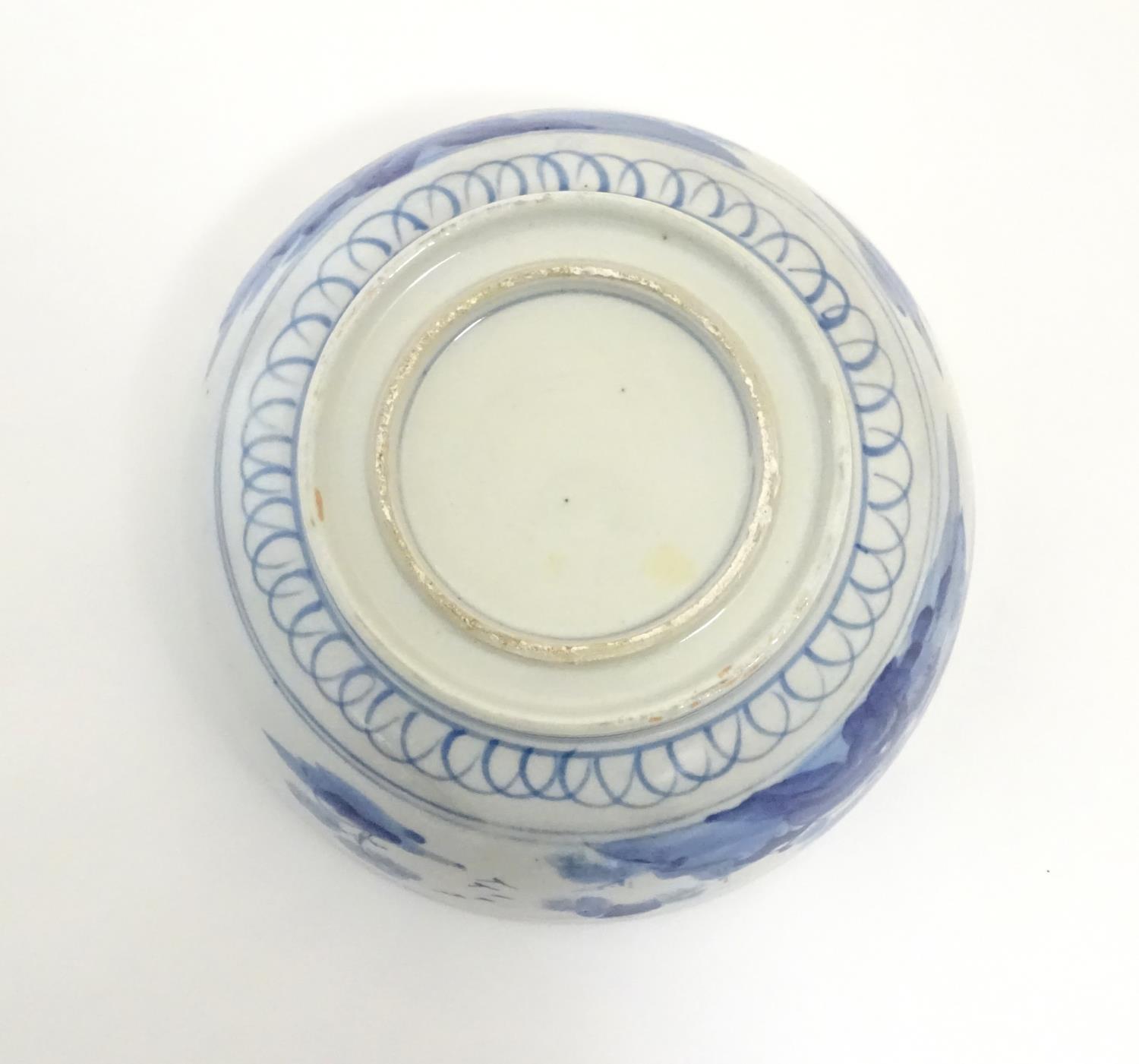 A Chinese blue and white bowl with hand painted decoration depicting an Oriental landscape with - Image 4 of 10