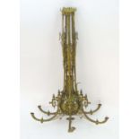 An early-20thC large gilt brass pendant/hanging hall electrolier, the six curved arms joined to a