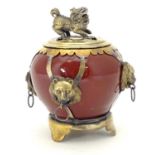 A Chinese high fired incense burner / ceramic pot with brass lid and mounts. The cover surmounted by