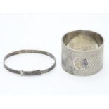 An Art Deco silver napkin ring with engine turned decoration. Hallmarked Sheffield 1933 maker Thomas