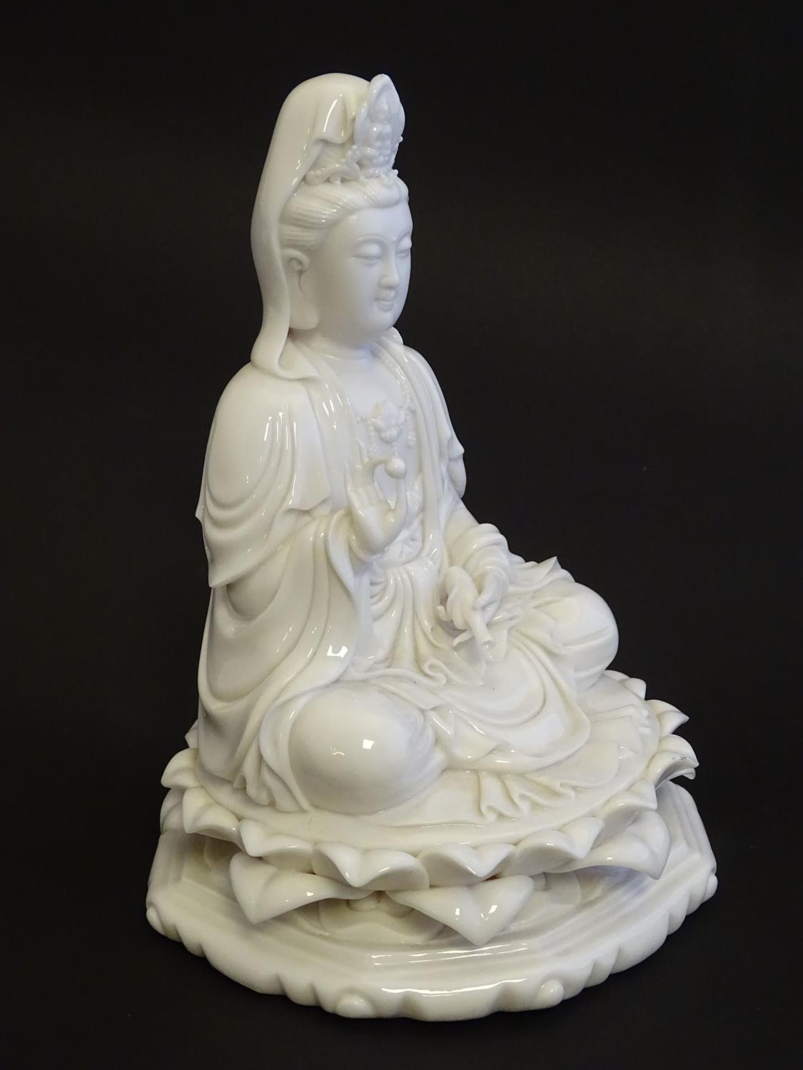 A Chinese blanc de chine figure depicting Guanyin seated on a lotus flower base. Approx. 7 1/2" high - Image 11 of 16