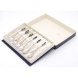 A cased set of 6 New Zealand silver teaspoons with abalone / paua shell decoration to handles.