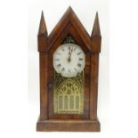 An American mantle clock with glazed door and having paper trade label to interior for 'Jerome & Co.