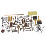 A quantity of assorted vintage hand tools, to include spirit levels, measures, tapes, shoe lasts,