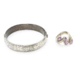 A silver bracelet of bangle form Hallmarked Birmingham 1974 together with a silver dress ring set