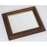 An early 20thC mirror with an oak frame and gilt surround. 18" high x 16" wide Please Note - we do