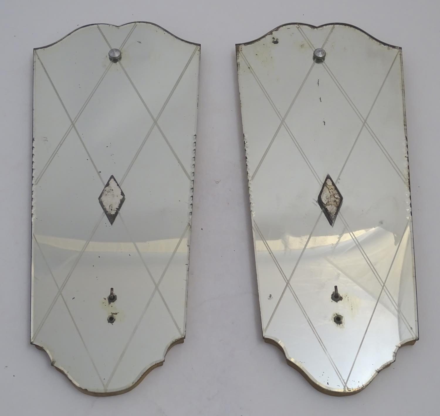 A pair of 20thC mirrored reflector sections for use with a girandole. 10 1/2" wide x 24" high.