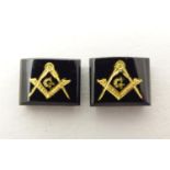 Two onyx stones set with gilt masonic symbols. Approx 1/4" wide Please Note - we do not make
