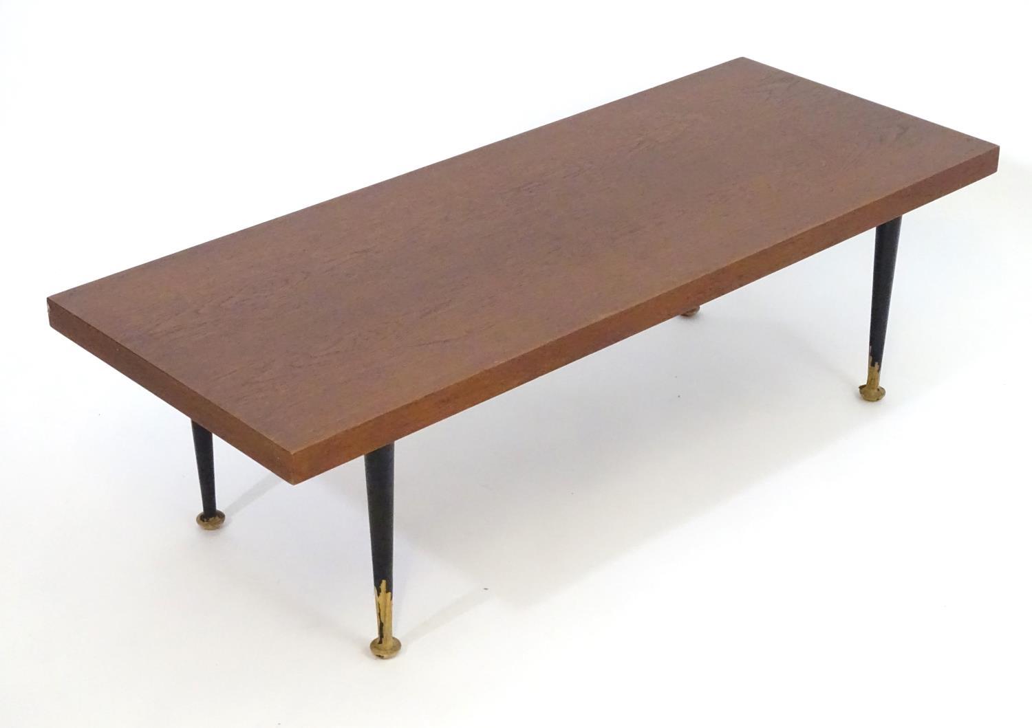 A mid 20thC Meredew coffee table with a rectangular teak top above four turned tapering legs. - Bild 2 aus 7