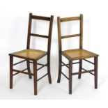 A pair of early 20thC side chairs with inlaid frames and caned seats above squared tapering legs.