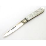 A Victorian fruit knife with silver blade and mother of pearl handle. Hallmarked Birmingham 1876. 4"