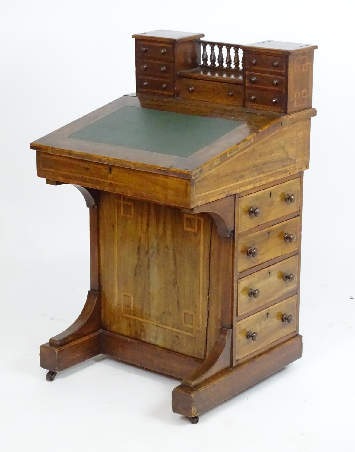 A mid / late 19thC walnut davenport with two banks of three short drawers together with a central - Bild 2 aus 8