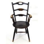 A mid 19thC Windsor chair with three shaped backrests, the top of these having a pierced handle, the