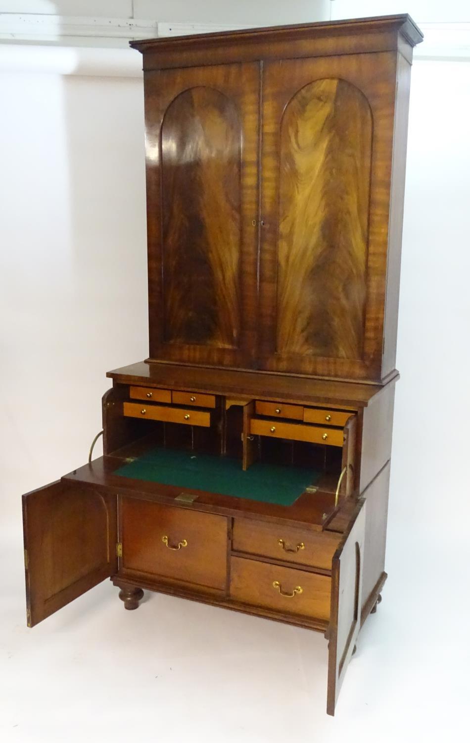 A mid 19thC mahogany secretaire bookcase, having a moulded cornice above two flame mahogany panelled - Bild 7 aus 8