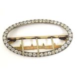 An early 20thC buckle of oval form with paste stone decoration. Approx. 1 1/2" x 2 1/2" Please