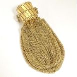 A Victorian gilt metal miser purse with a concertina action. Approx. 4" Please Note - we do not make