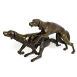 A 20thC large bronze sculpture modelled as two dogs / hounds running. Approx. 25" high x 41" long