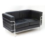 A late 20thC Le Corbusier LC3 settee with leather backrests, seats, arms and a chromed frame.