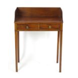 An early 19thC mahogany washstand with a shaped upstand above a single short drawer and faux