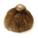 A vintage fur hat Please Note - we do not make reference to the condition of lots within