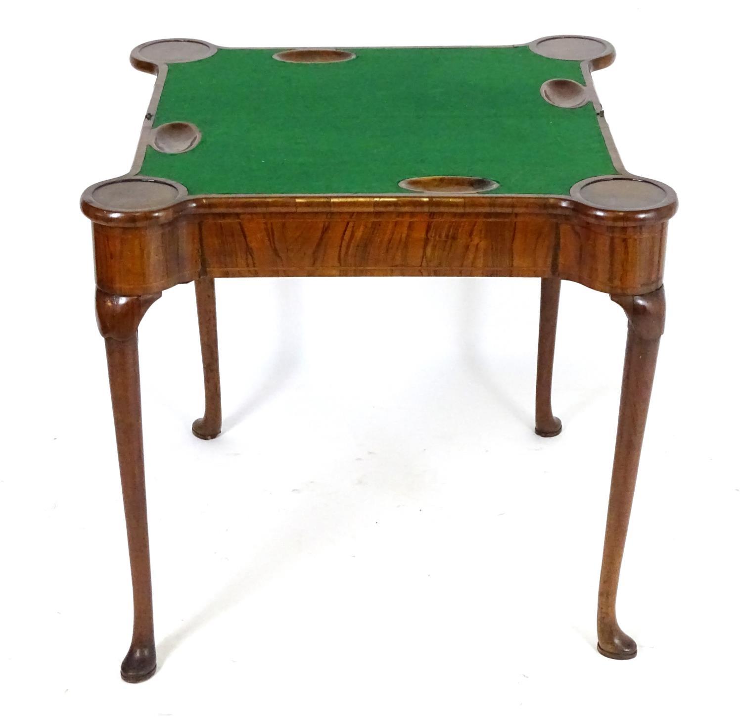 A George I walnut card table with castellated corners, opening to show a baize playing surface and - Bild 8 aus 10