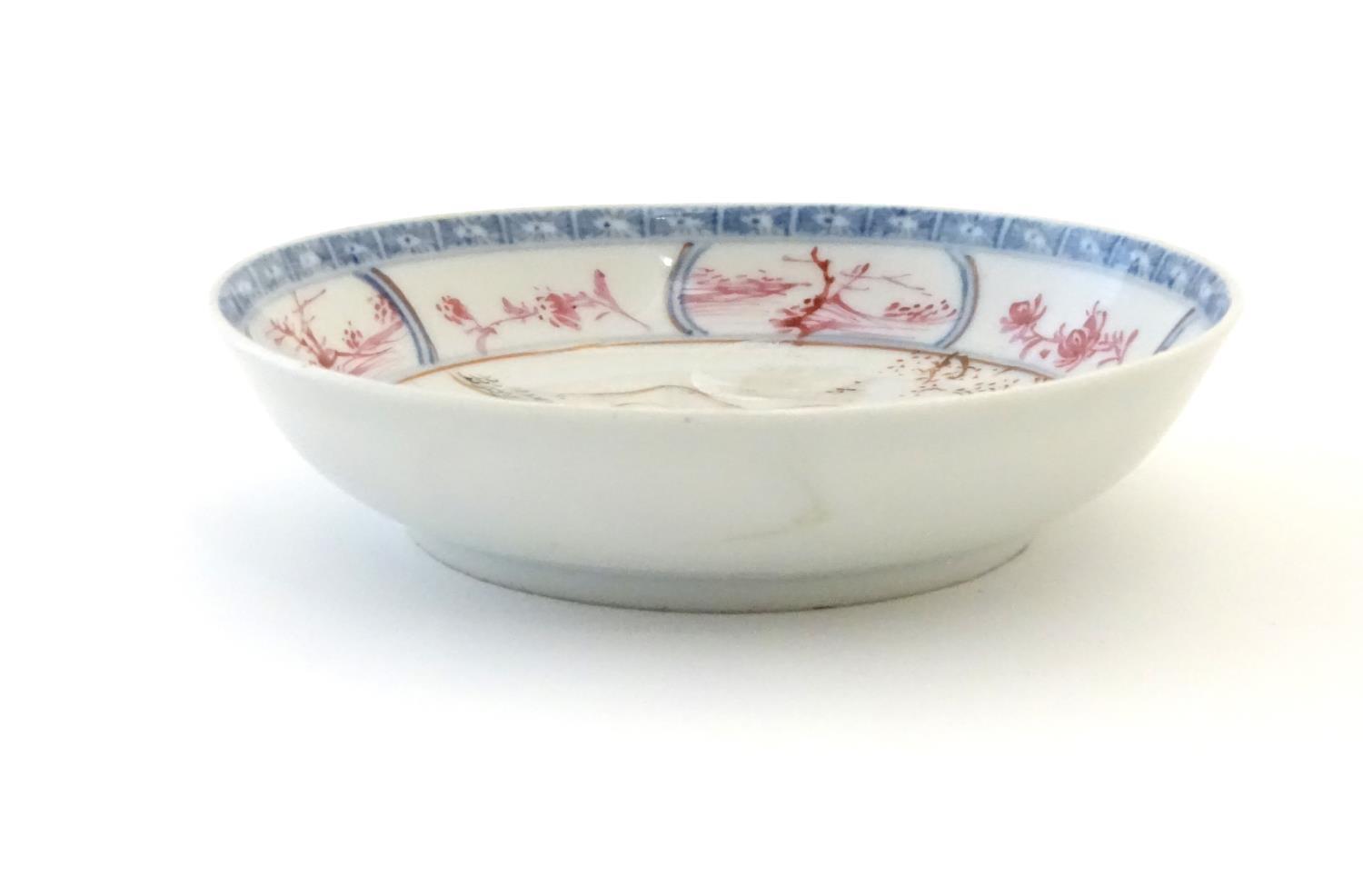 An Oriental famille rose dish depicting a mountainous landscape scene with two figures and a child - Image 5 of 5