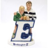 Brewiana : A Beswick bar top adverting figure group for ' Worthington E ' . Depicting rugby