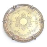 A silver plate salver with engraved decoration. Approx 15" diameter Please Note - we do not make