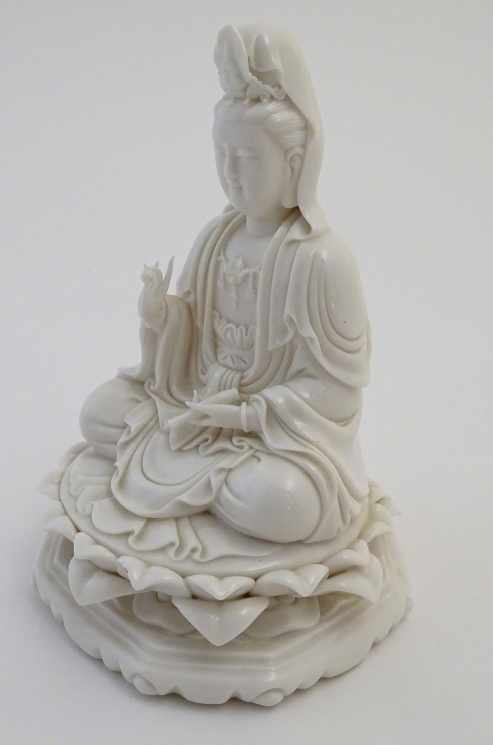 A Chinese blanc de chine figure depicting Guanyin seated on a lotus flower base. Approx. 7 1/2" high - Image 4 of 16