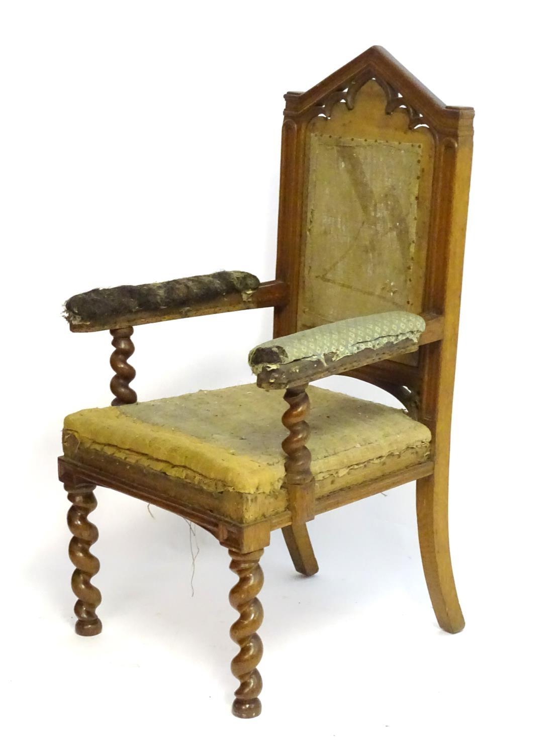 A mid / late 19thC oak armchair with a pointed pierced cresting rail, moulded frame and raised on - Bild 6 aus 6