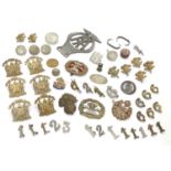 Militaria: a collection of 20thC military badges, including an early 20thC white metal dog tag (