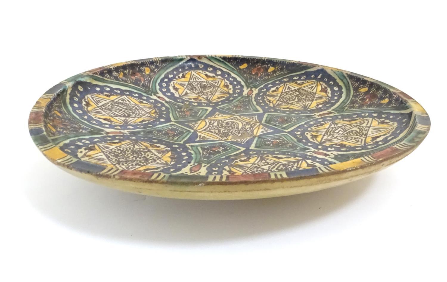 A Moroccan charger with geometric designs, vignettes with six point star detail and Islamic - Image 3 of 5